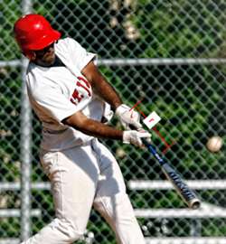 A baseball player hitting a ball with a bat